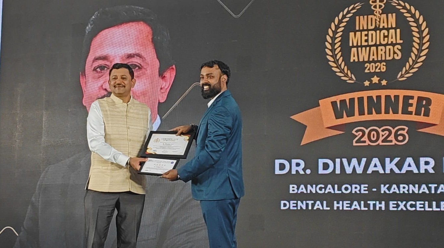 Dr. Diwakar receiving the Indian Medical Awards 2026 recognition on stage